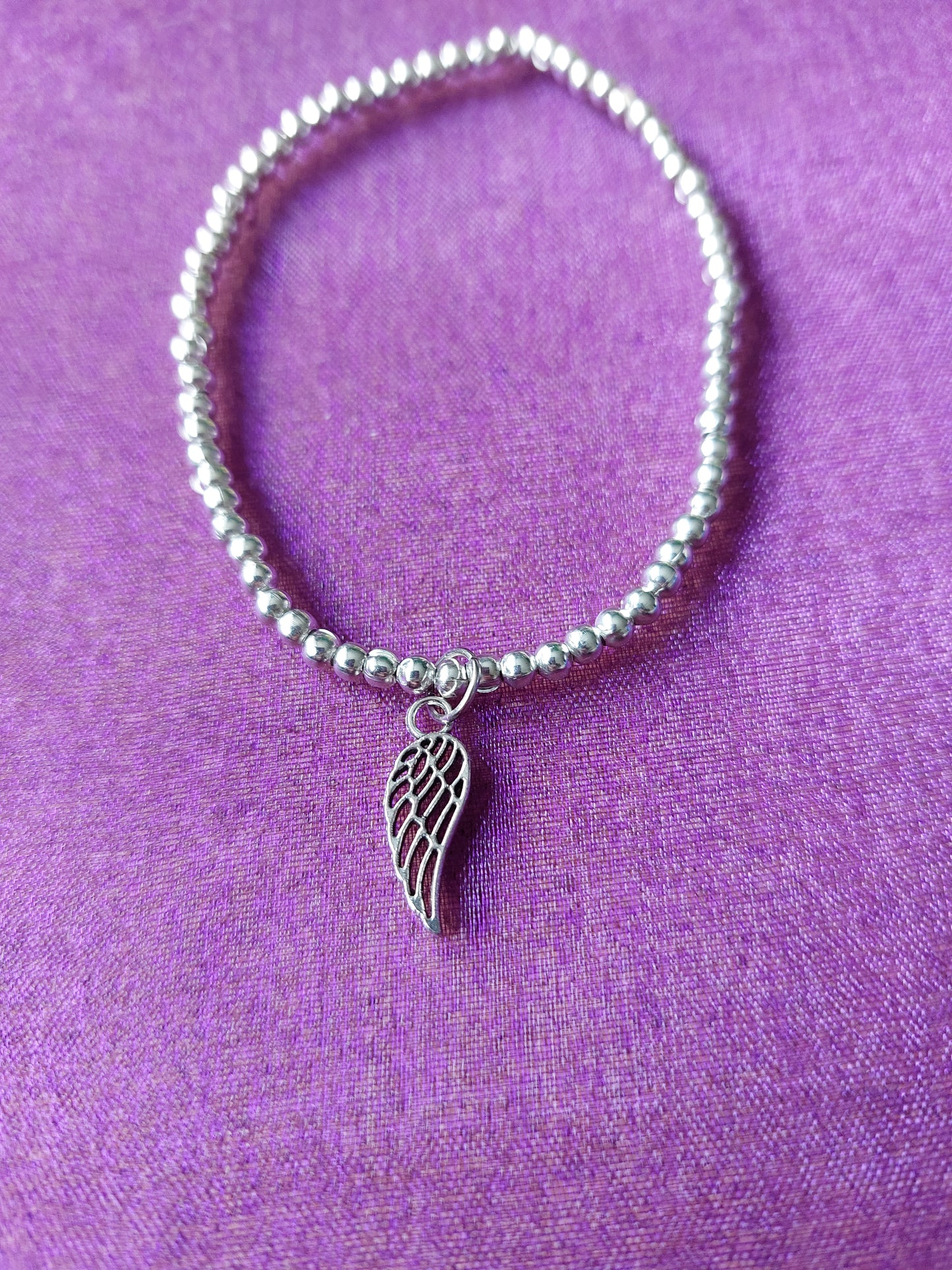 Angel Wing Charm Bracelet | Beaded Elastic Jewellery | Spiritual & Statement Accessory