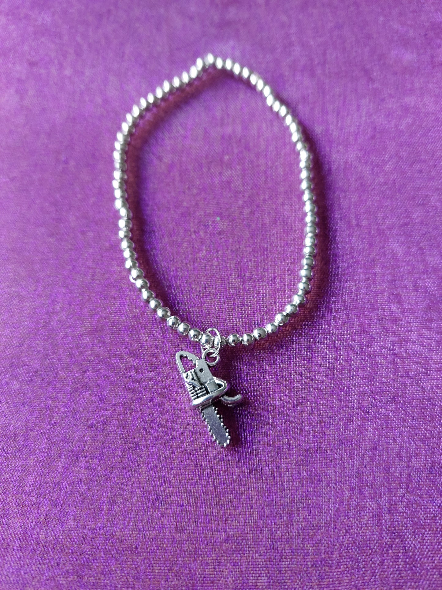 Beaded Chainsaw Charm Bracelet | Silver Beads | Elasticated One Size | Horror & Gothic Jewellery