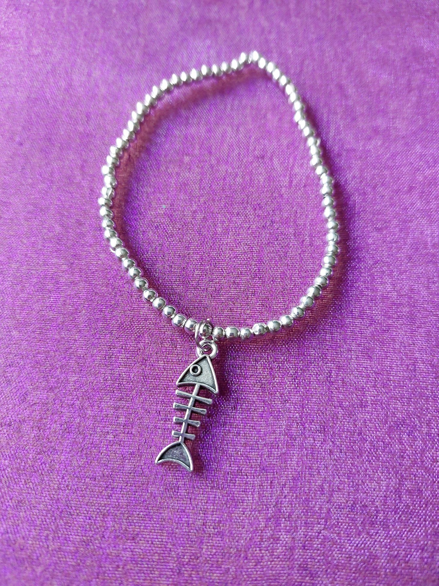 Spooky Fish Skeleton Charm Bracelet | Silver Plated Pendant on Elastic Beads | Halloween or Gothic Wrist Accessory