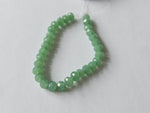 faceted glass beads - 6mm x 4mm - rondelle - green