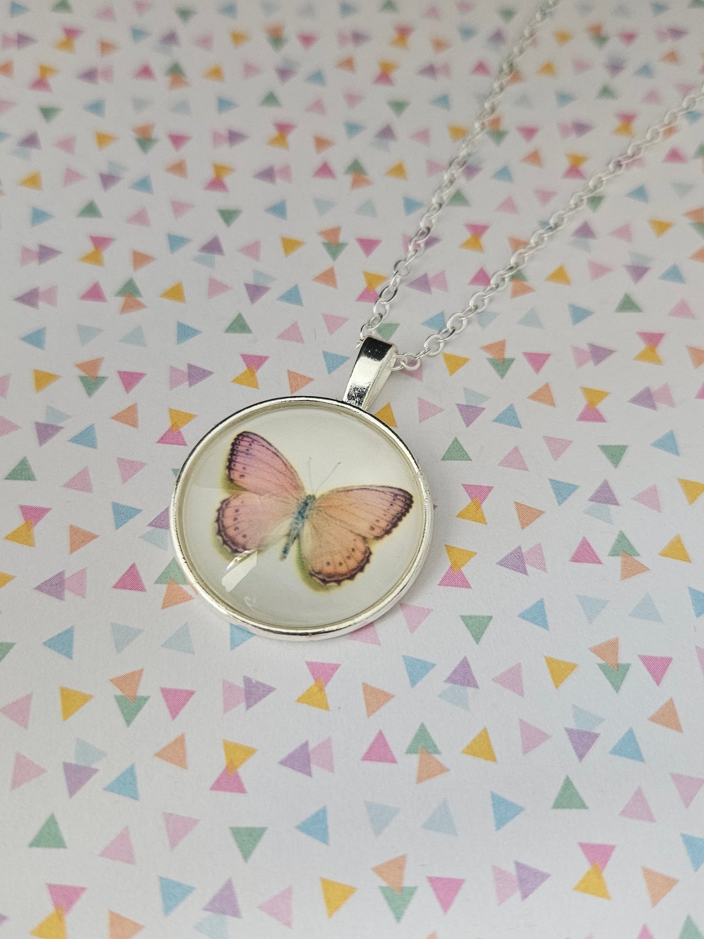 pink butterfly glass dome necklace
