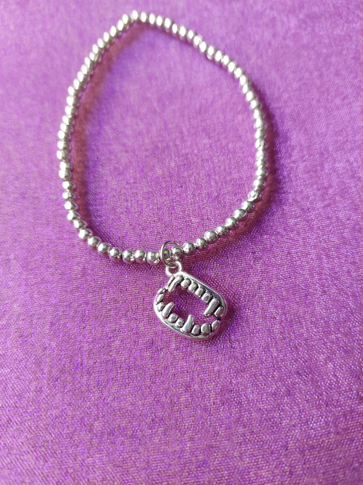Beaded Vampire Fangs Charm Bracelet | Silver Plated Pendant on Elastic | Halloween & Gothic Jewelry