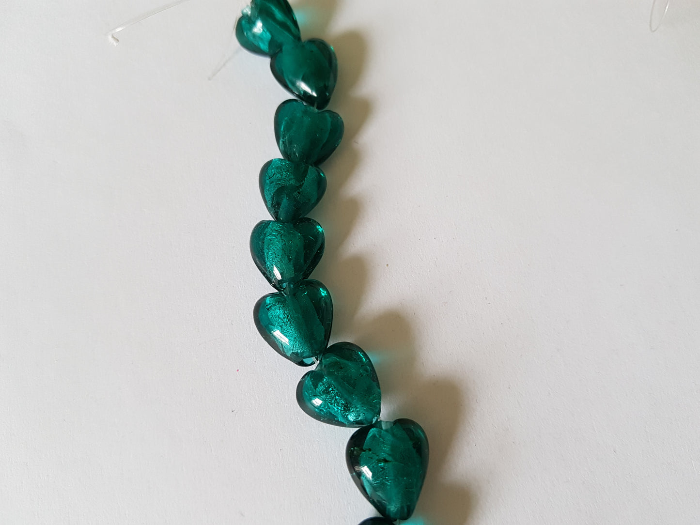 12mm foil-lined glass heart beads - green