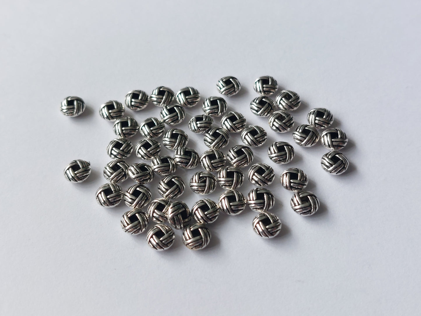 50 x alloy spacer beads - woven knot - 6mm - silver plated