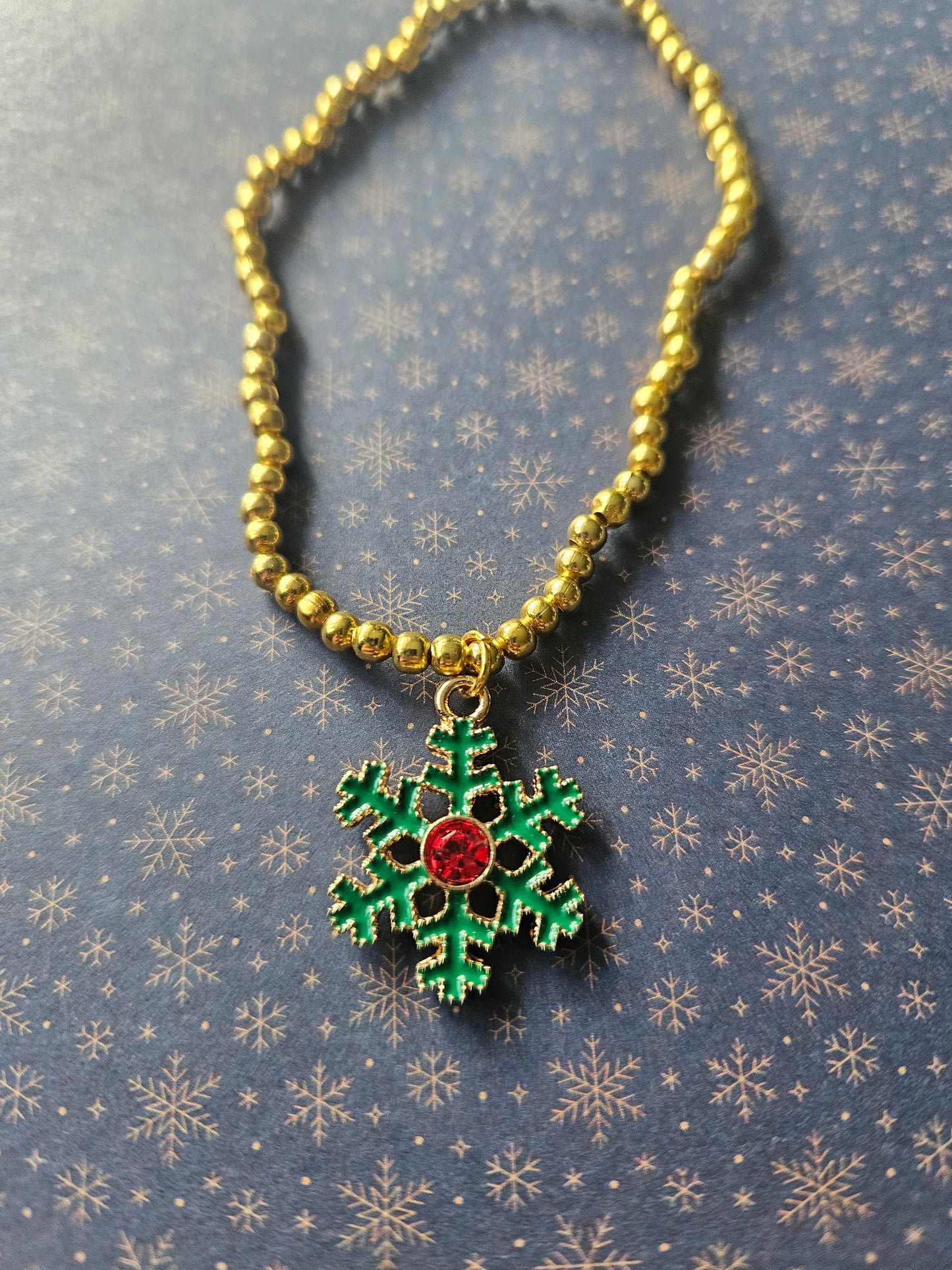 Beaded Snowflake Bracelet | Gold Tone Beads | Enamel Rhinestone Charm | Elasticated Winter Christmas Jewellery