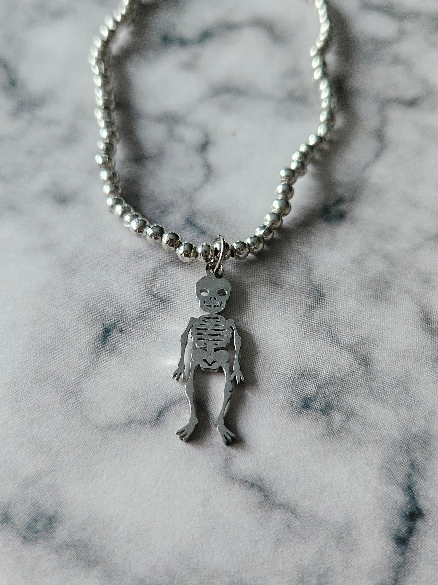 Beaded Skeleton Bracelet | Silver Tone Beads | Stainless Steel Skeleton Charm | Elasticated Gothic Jewellery