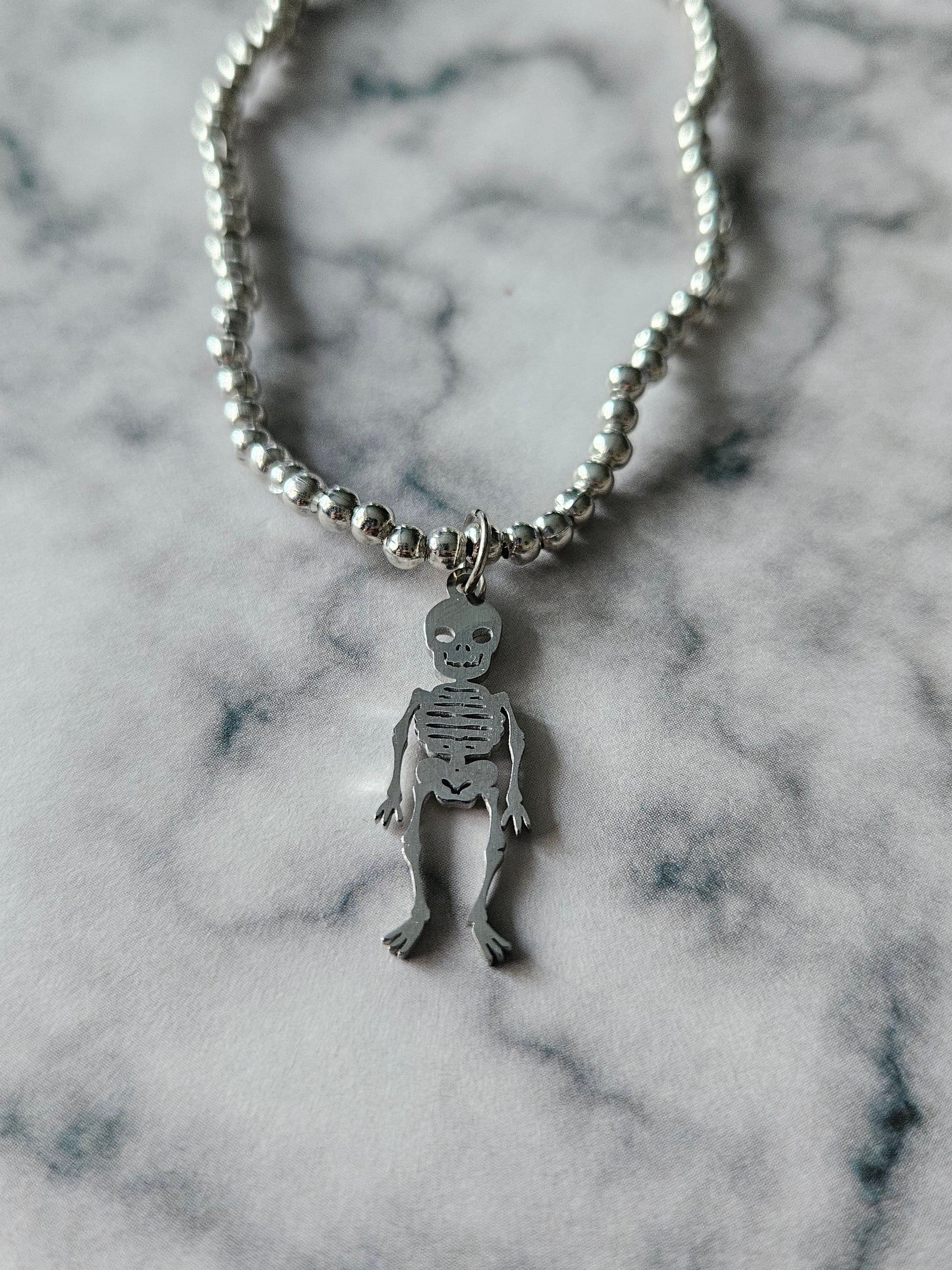 Beaded Skeleton Bracelet | Silver Tone Beads | Stainless Steel Skeleton Charm | Elasticated Gothic Jewellery