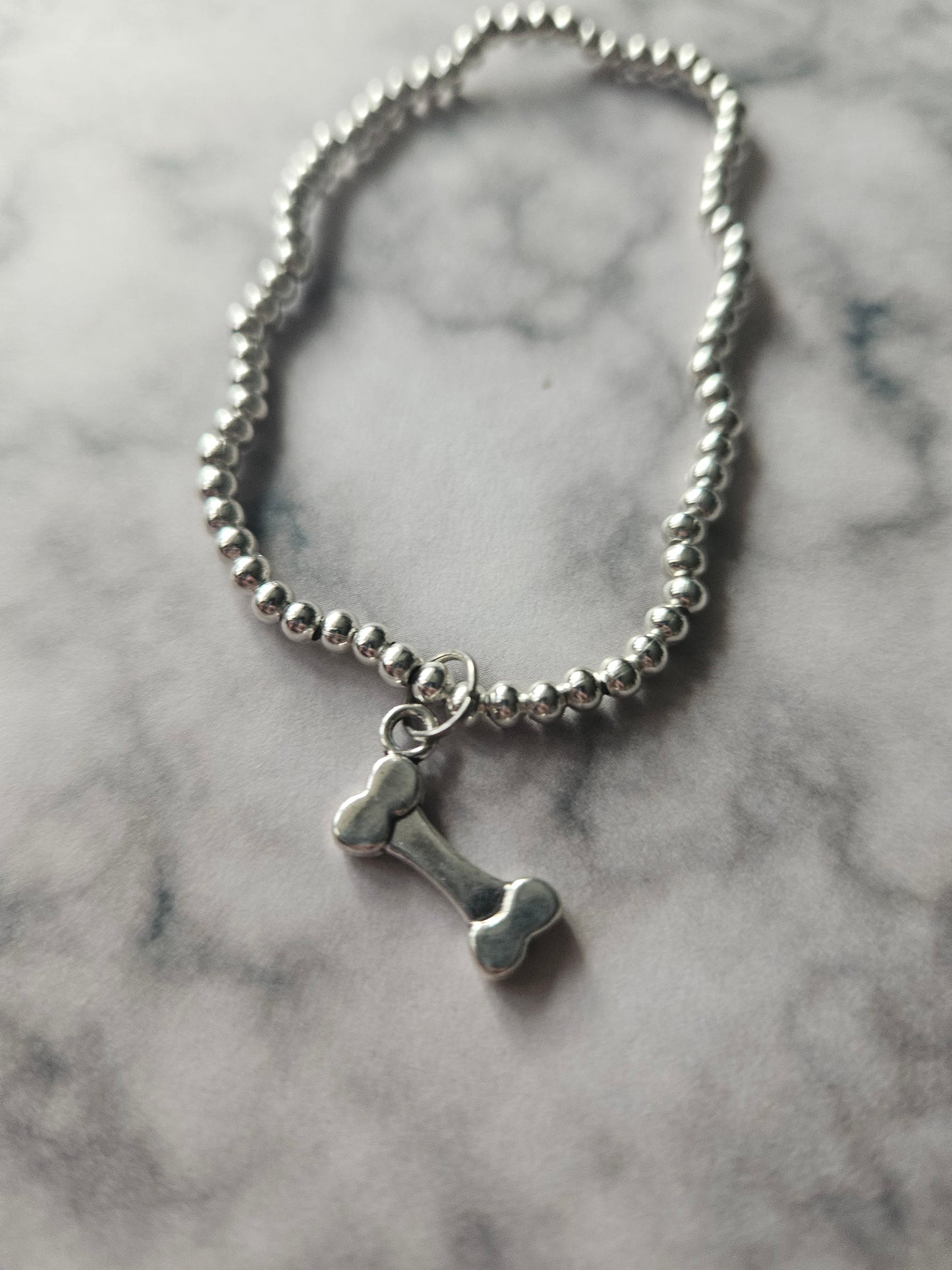 Beaded Bone Bracelet | Silver Tone Beads | Enamel Bone Charm | Elasticated Spooky Gothic Halloween Jewellery