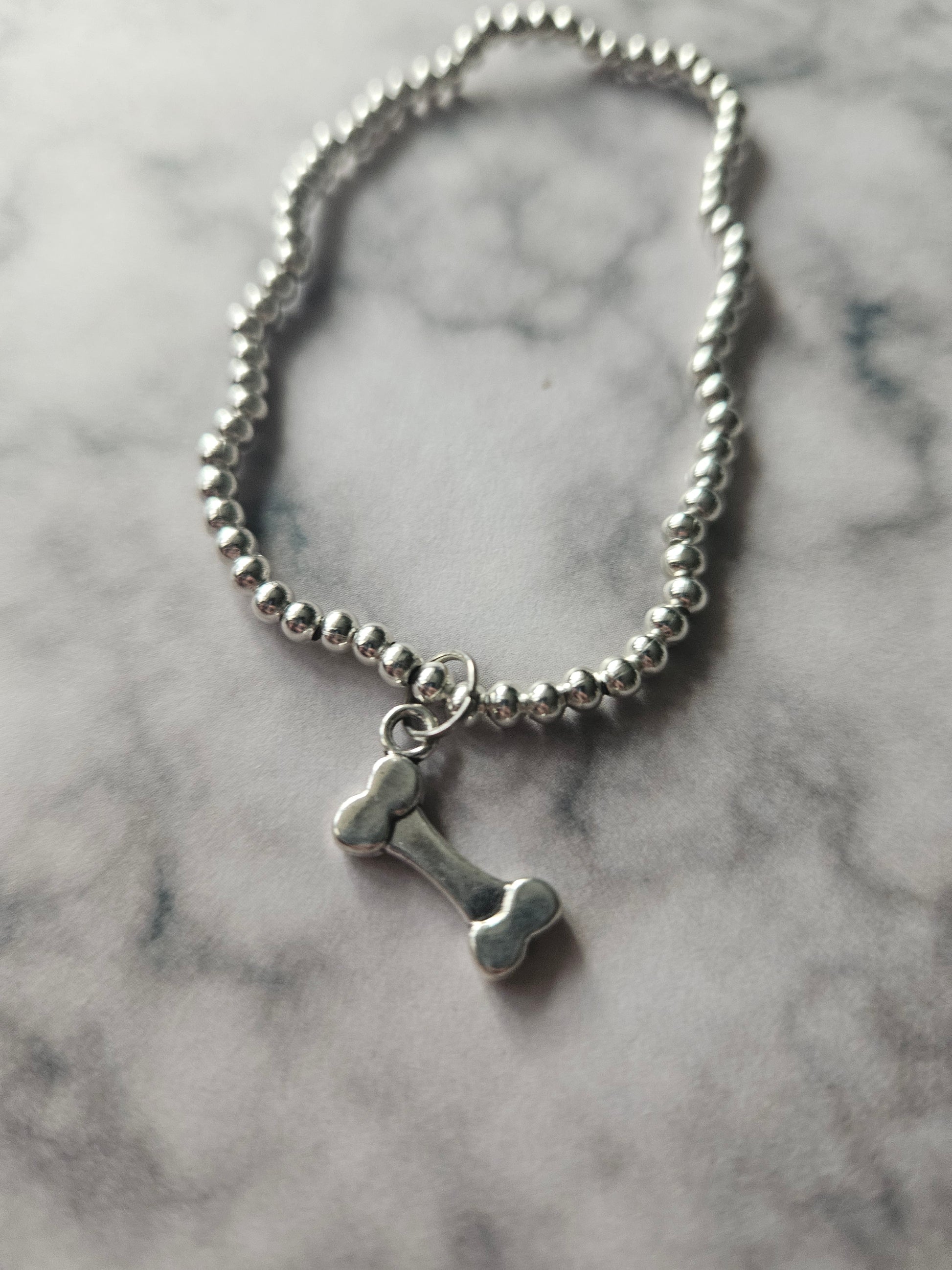 Beaded Bone Bracelet | Silver Tone Beads | Enamel Bone Charm | Elasticated Spooky Gothic Halloween Jewellery