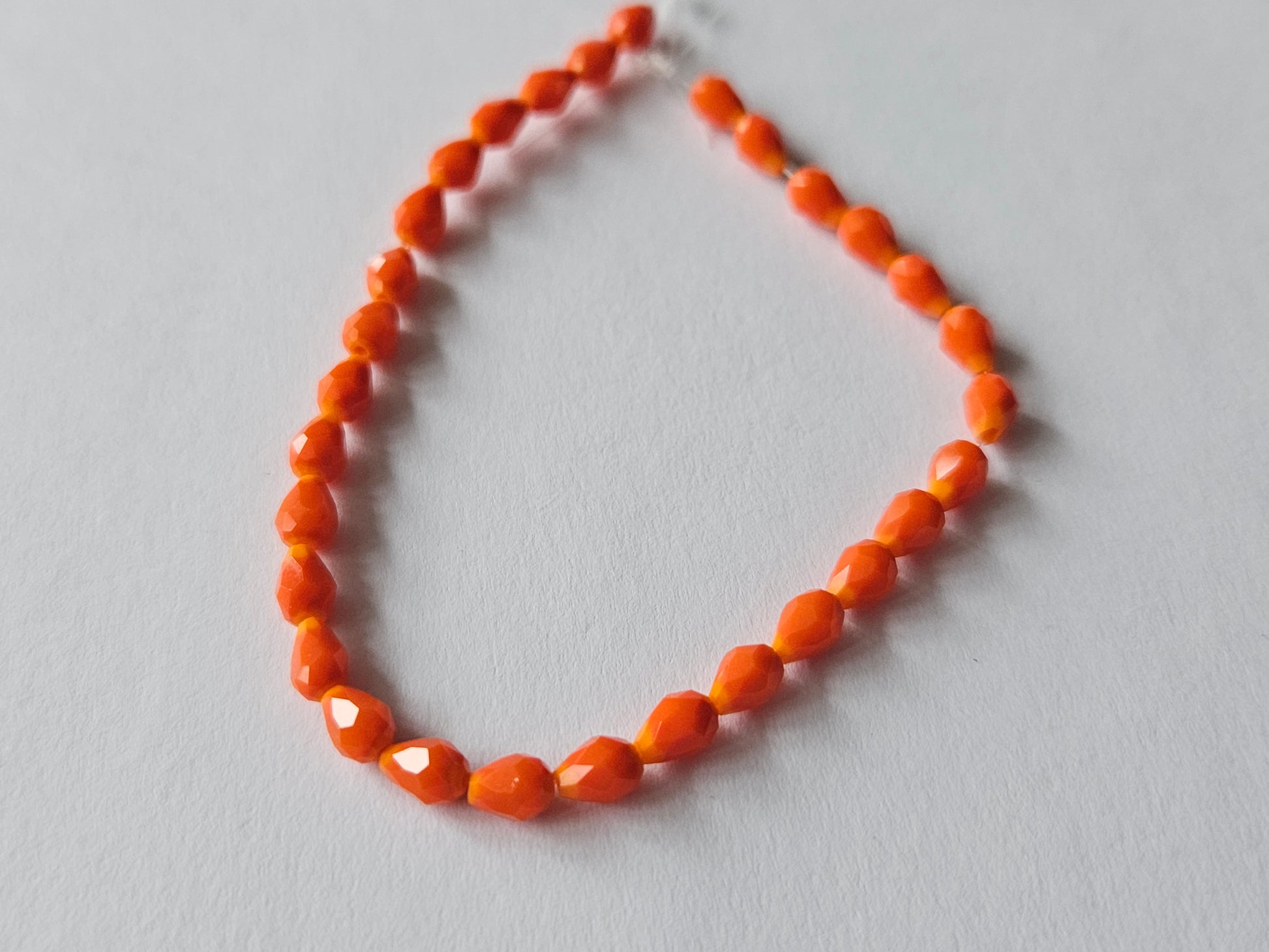 faceted glass beads - 5mm x 3mm - teardrop - orange 