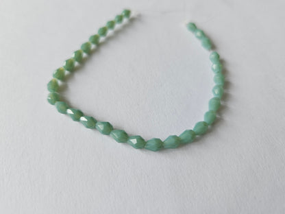 faceted glass beads - 5mm x 3mm - teardrop - pale green 