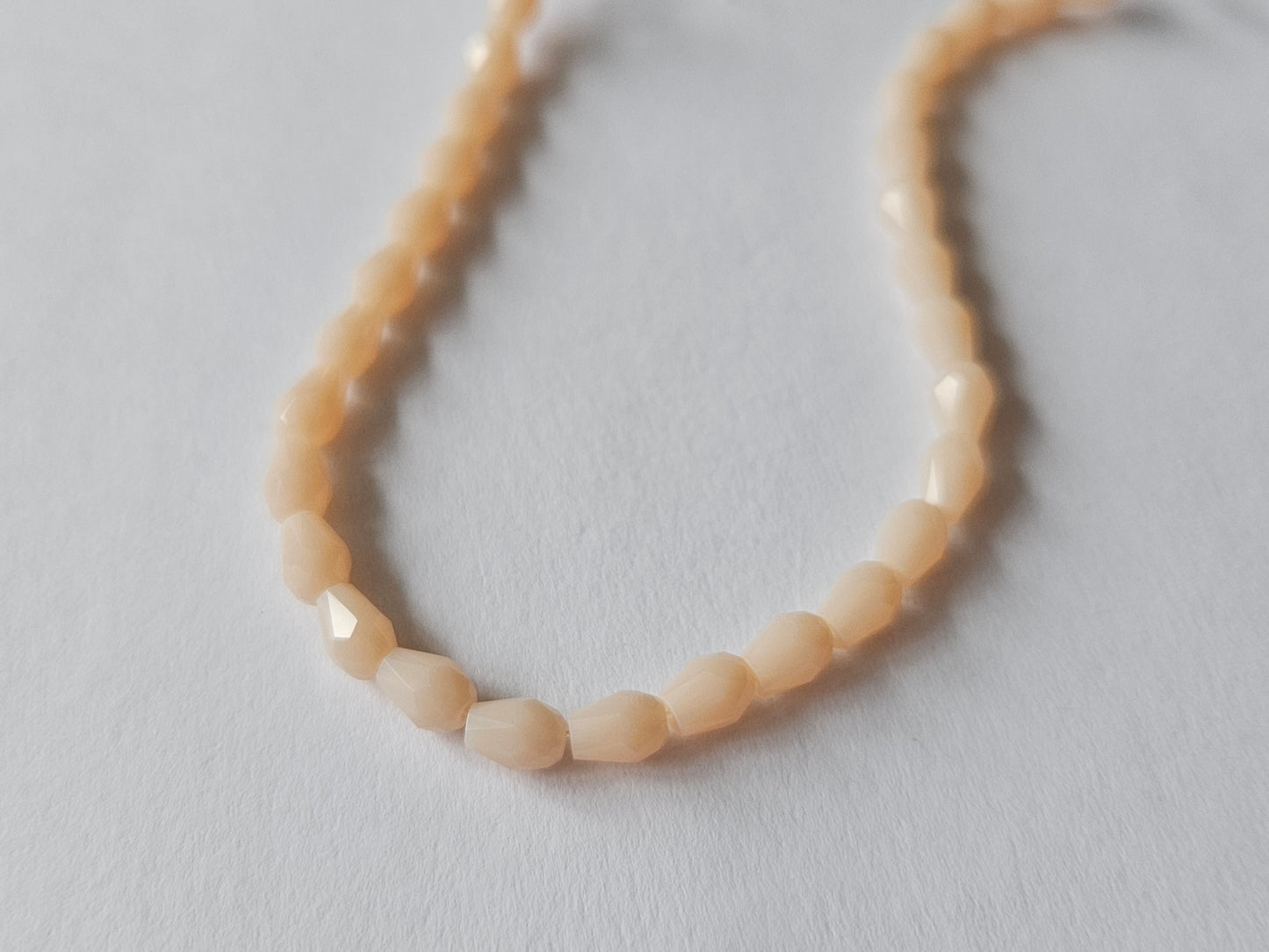 faceted glass beads - 5mm x 3mm - teardrop - peach 