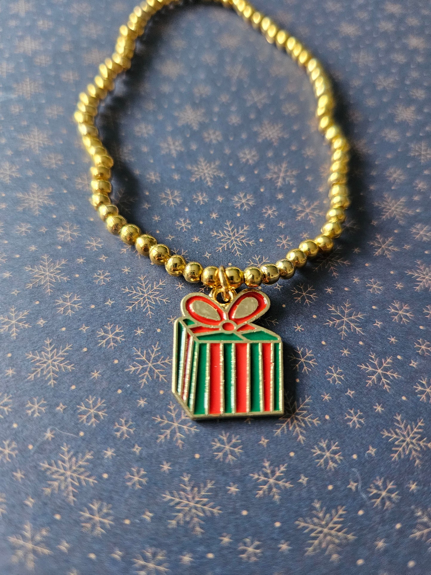 Beaded Christmas Present Bracelet | Gold Tone Beads | Enamel Gift Charm | Elasticated Festive Holiday Jewellery