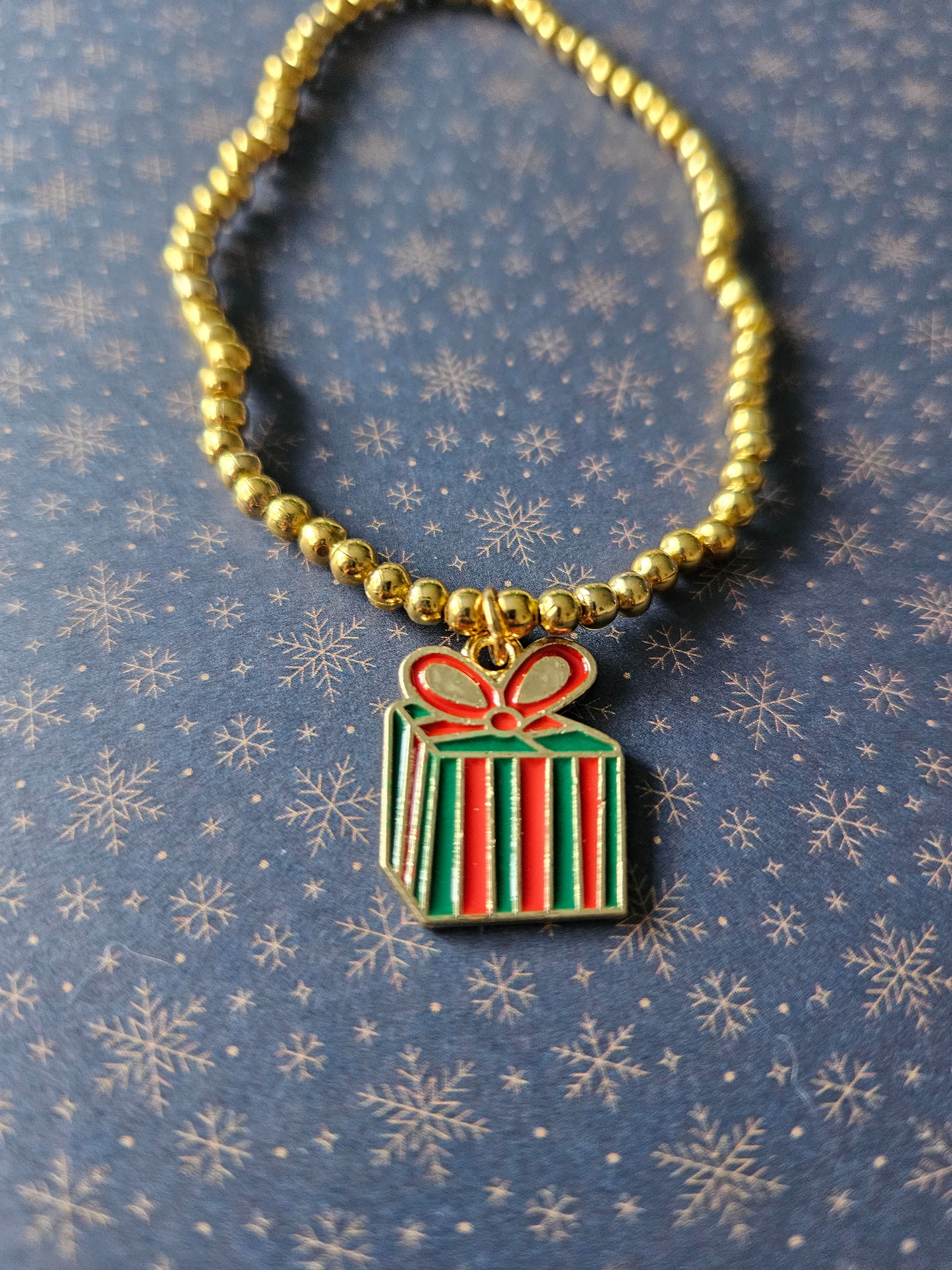 Beaded Christmas Present Bracelet | Gold Tone Beads | Enamel Gift Charm | Elasticated Festive Holiday Jewellery