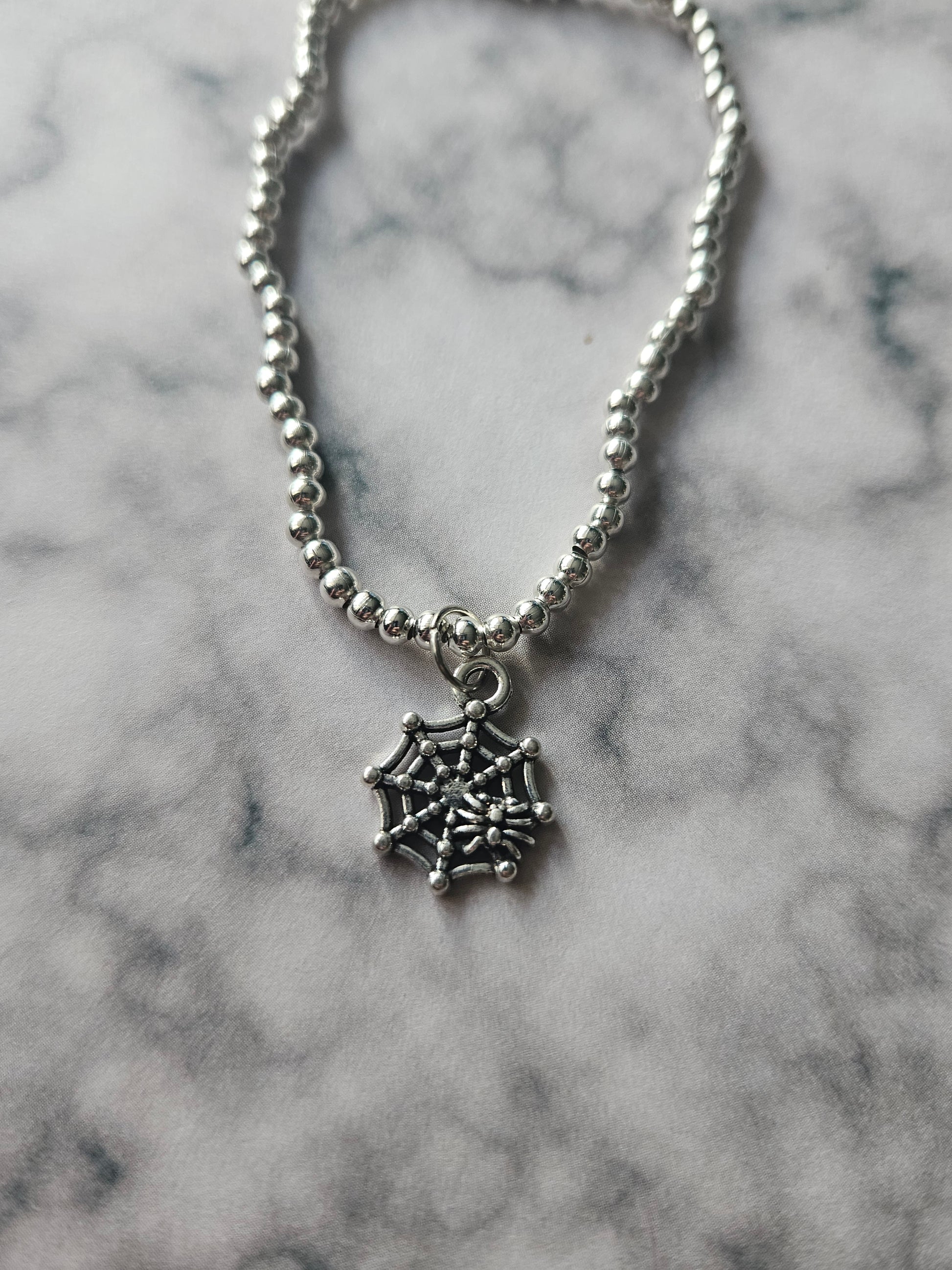 Beaded Spiderweb Bracelet | Silver Tone Beads | Enamel Spiderweb Charm | Elasticated Halloween Gothic Jewellery