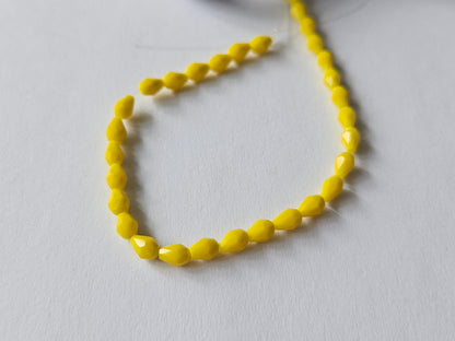 faceted glass beads - 5mm x 3mm - teardrop - yellow 