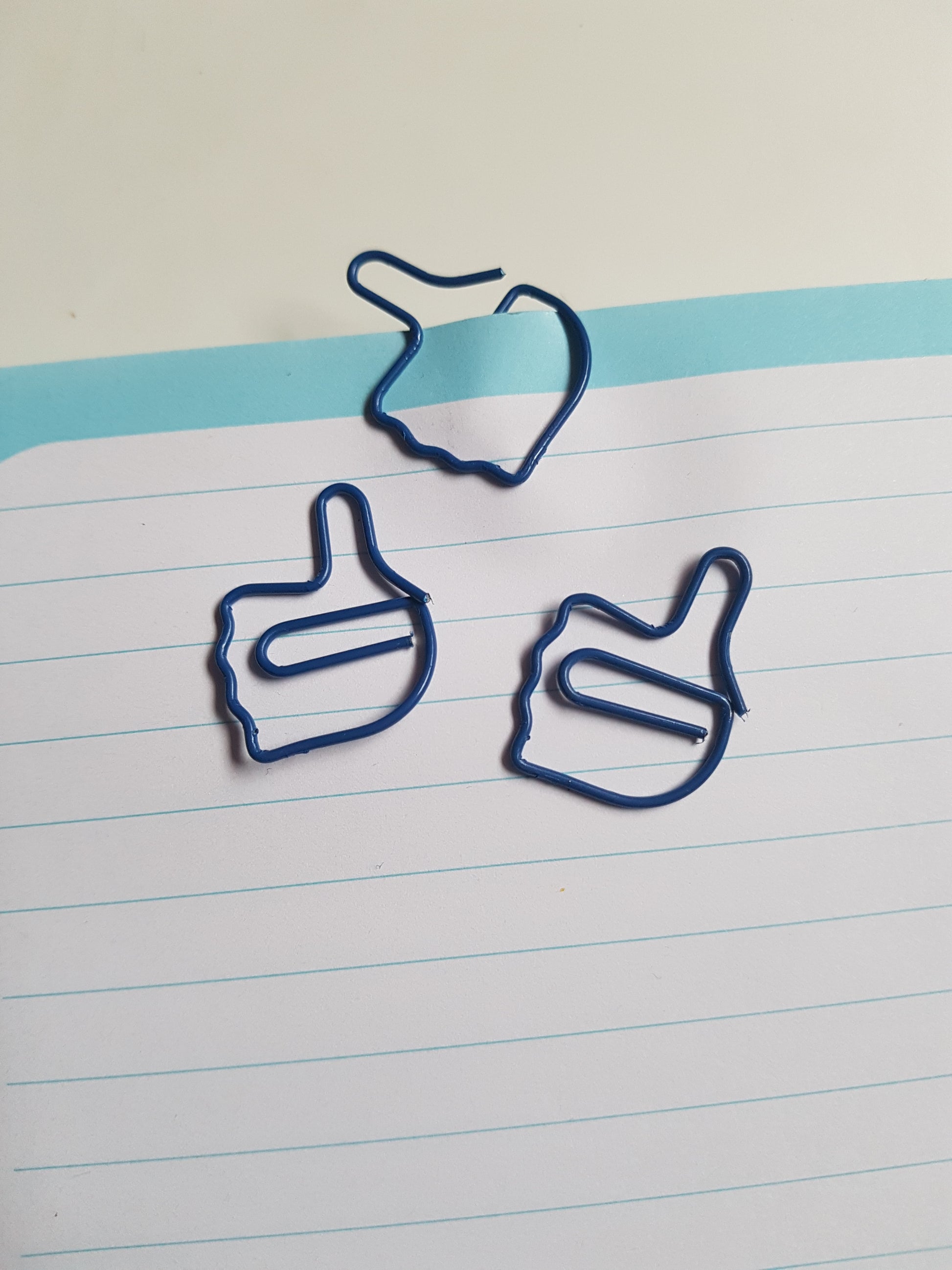 blue thumbs up hand paper clips