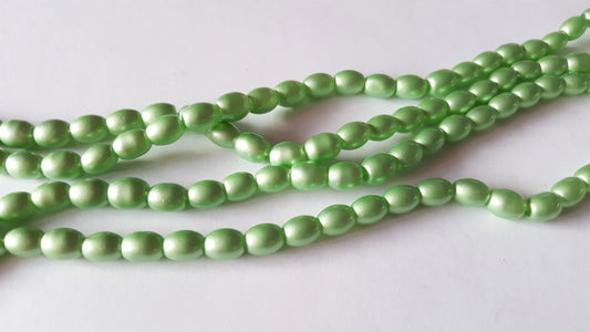 sprayed glass oval beads - pastels - green