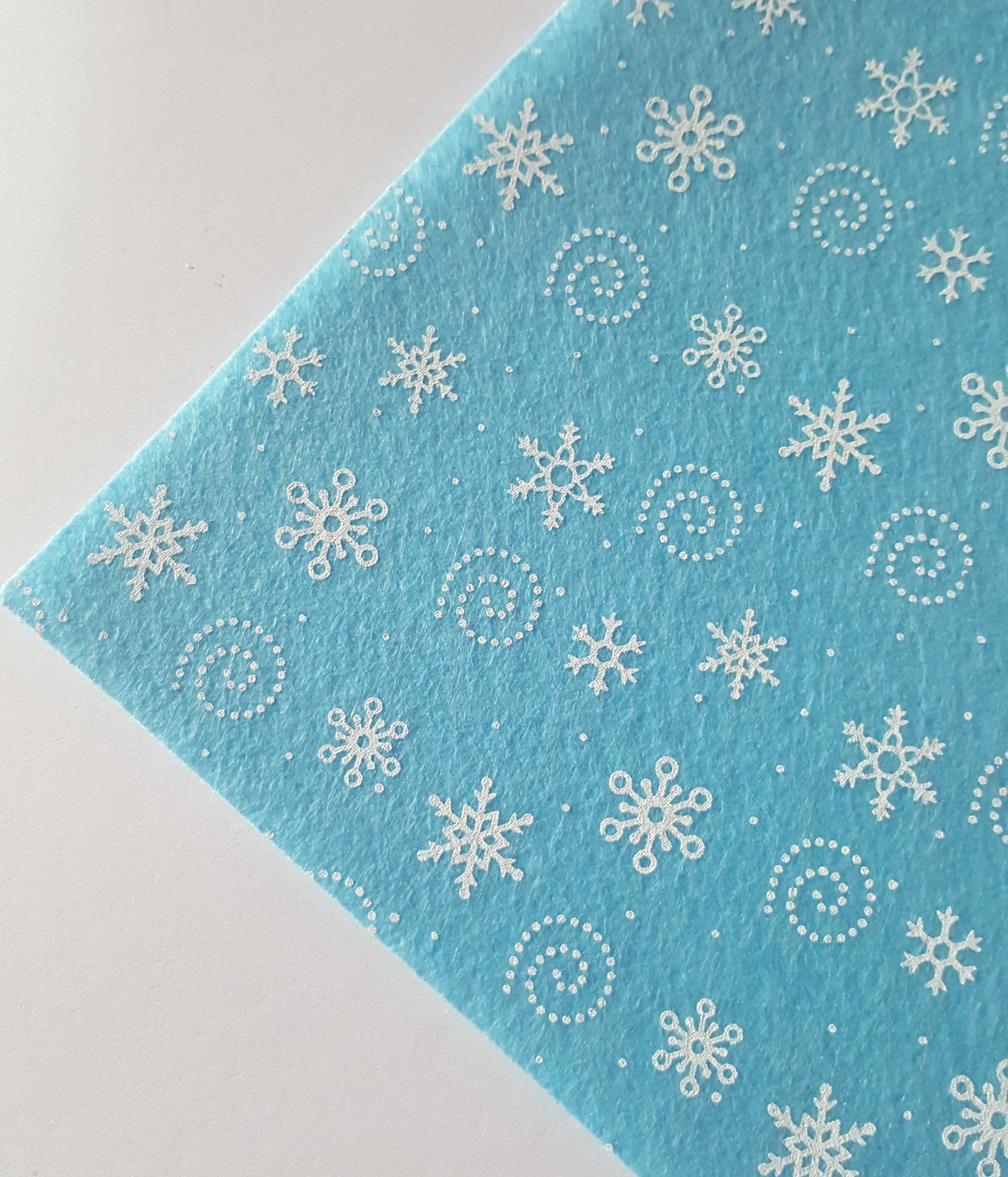 printed felt sheet - snowflakes - bright blue