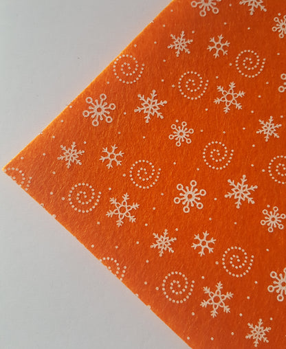 printed felt sheet - snowflakes - orange