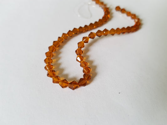 4mm glass bicone beads - amber