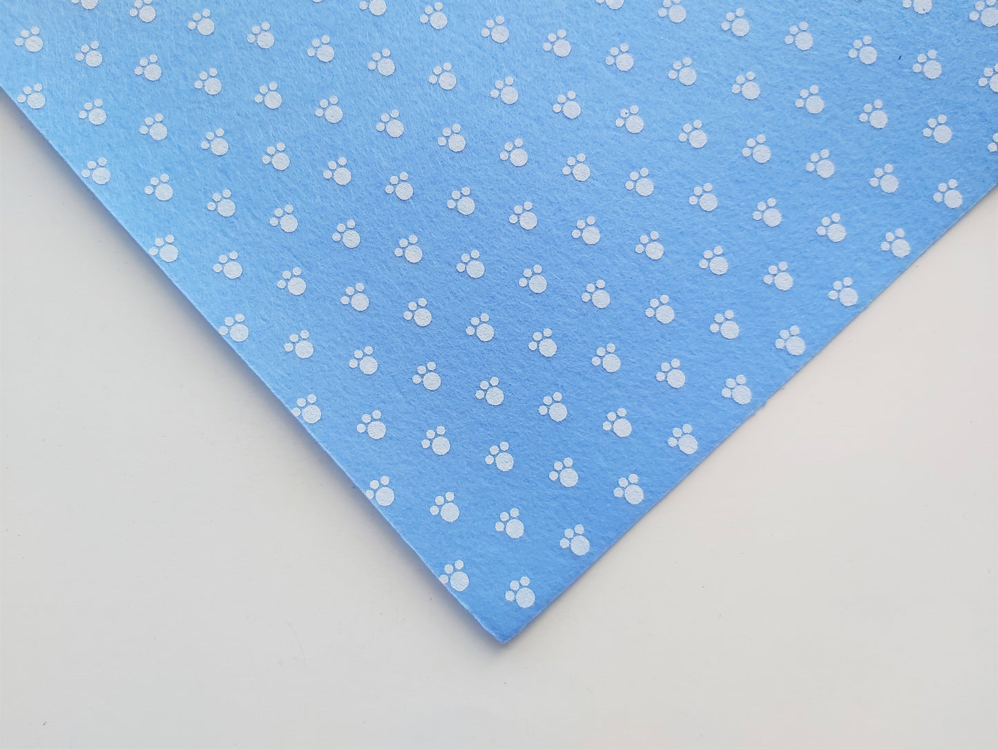 12" printed felt sheet - pawprints - blue