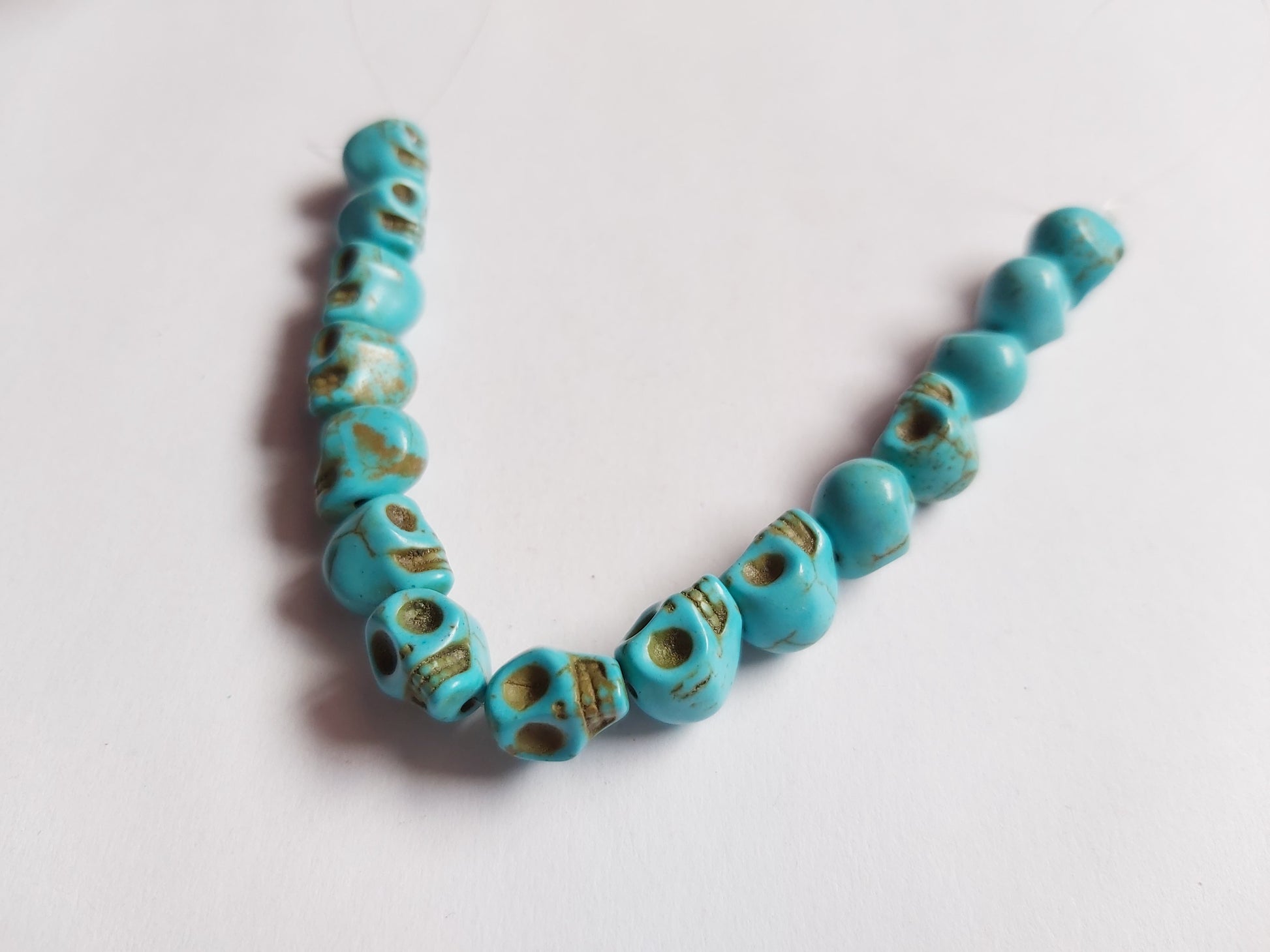 9mm turquoise skull beads - blue