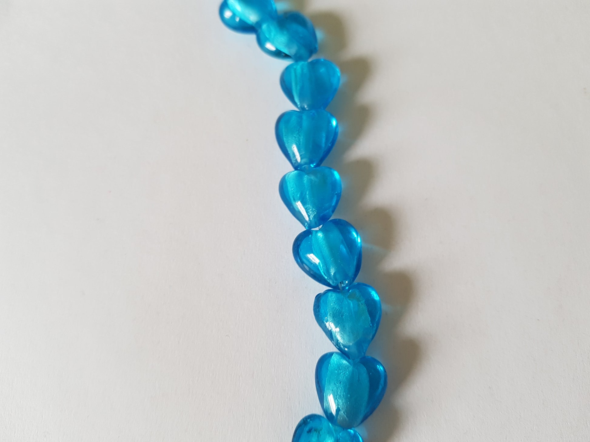 12mm foil-lined glass heart beads - blue