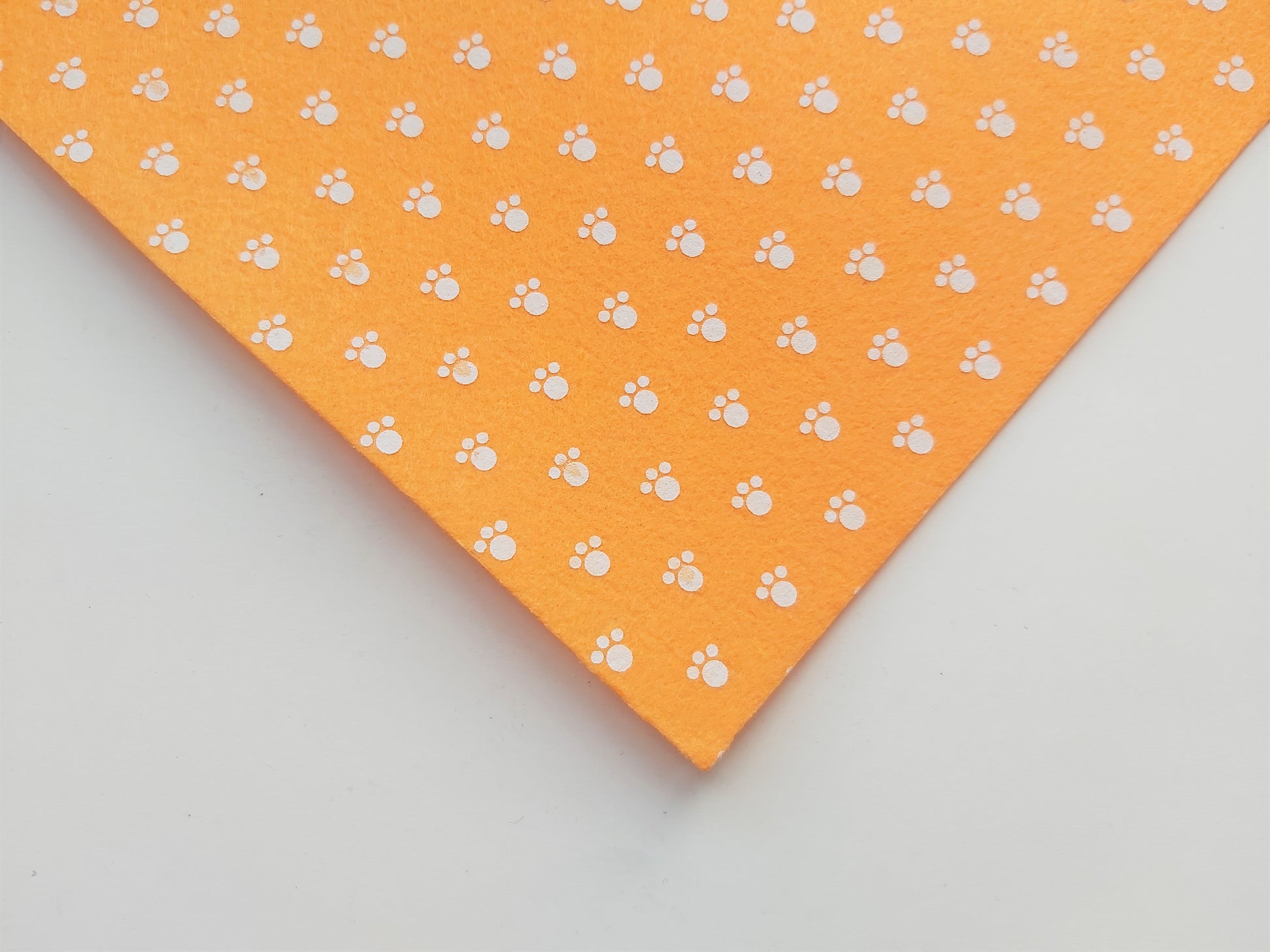 12" printed felt sheet - pawprints - orange