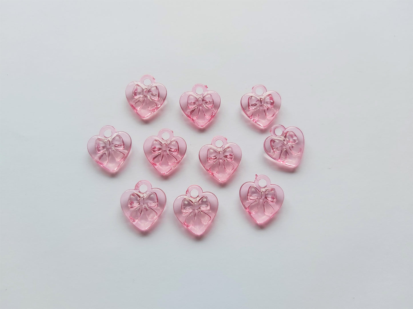 17mm acrylic heart pendants - bow design - pink