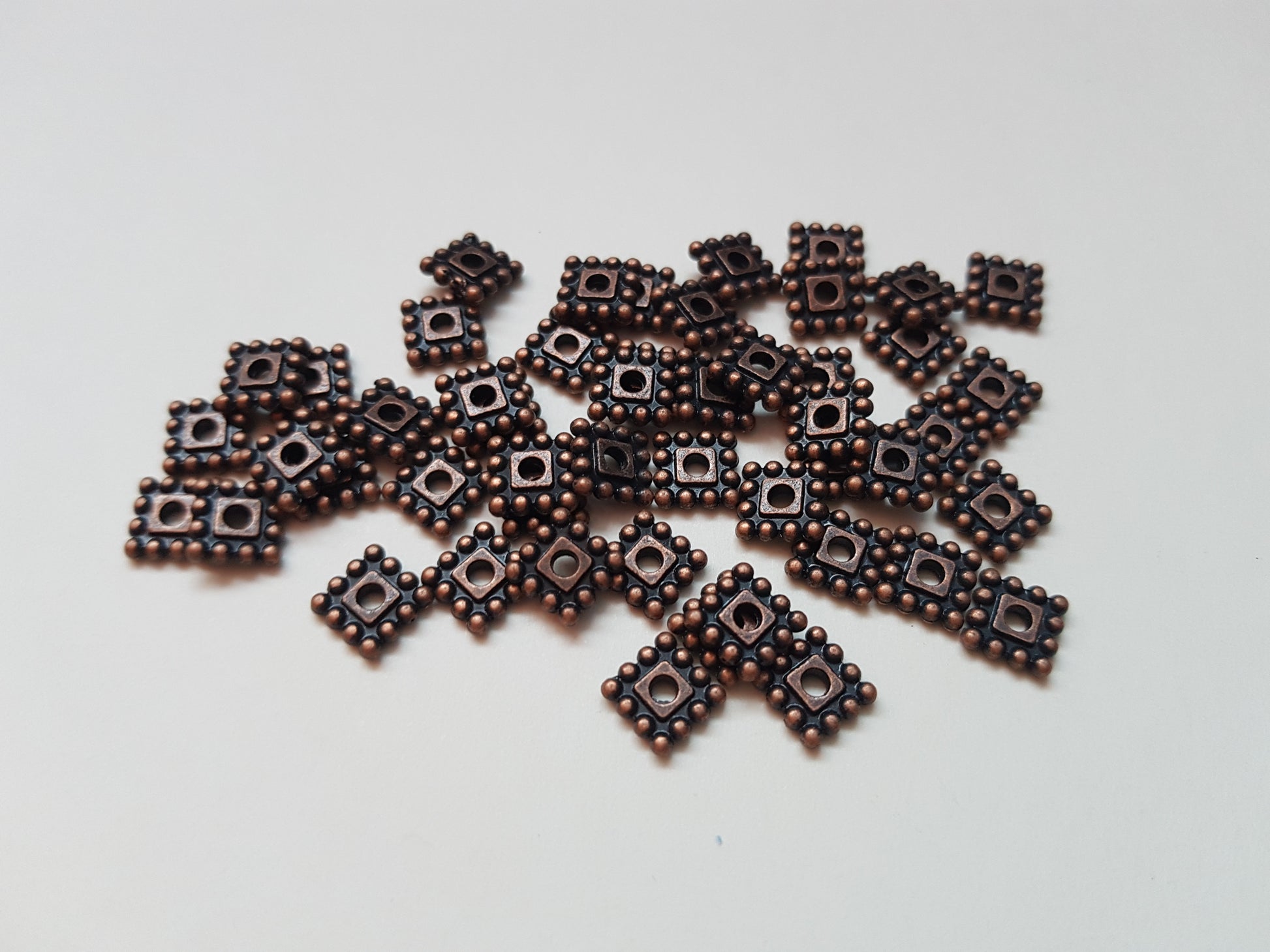 7mm square spacer beads - red copper plated 