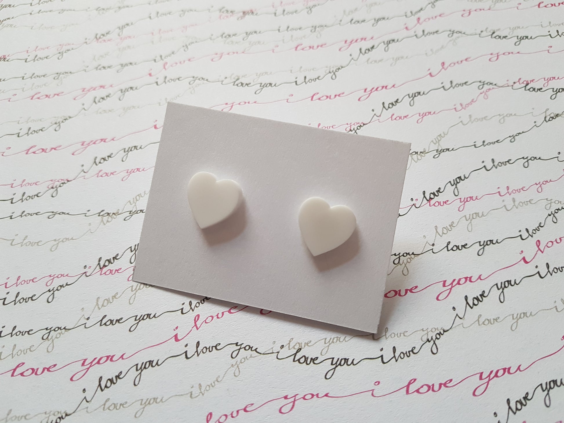 heart stud earrings - white