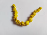 9mm turquoise skull beads - yellow